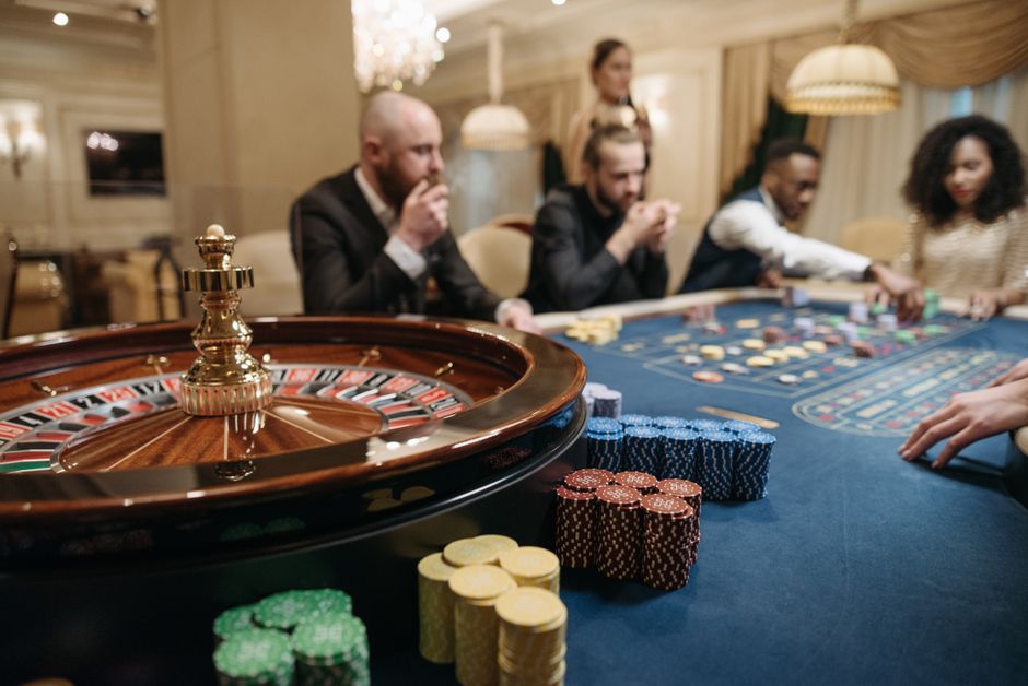 Players at a roulette table in a casino